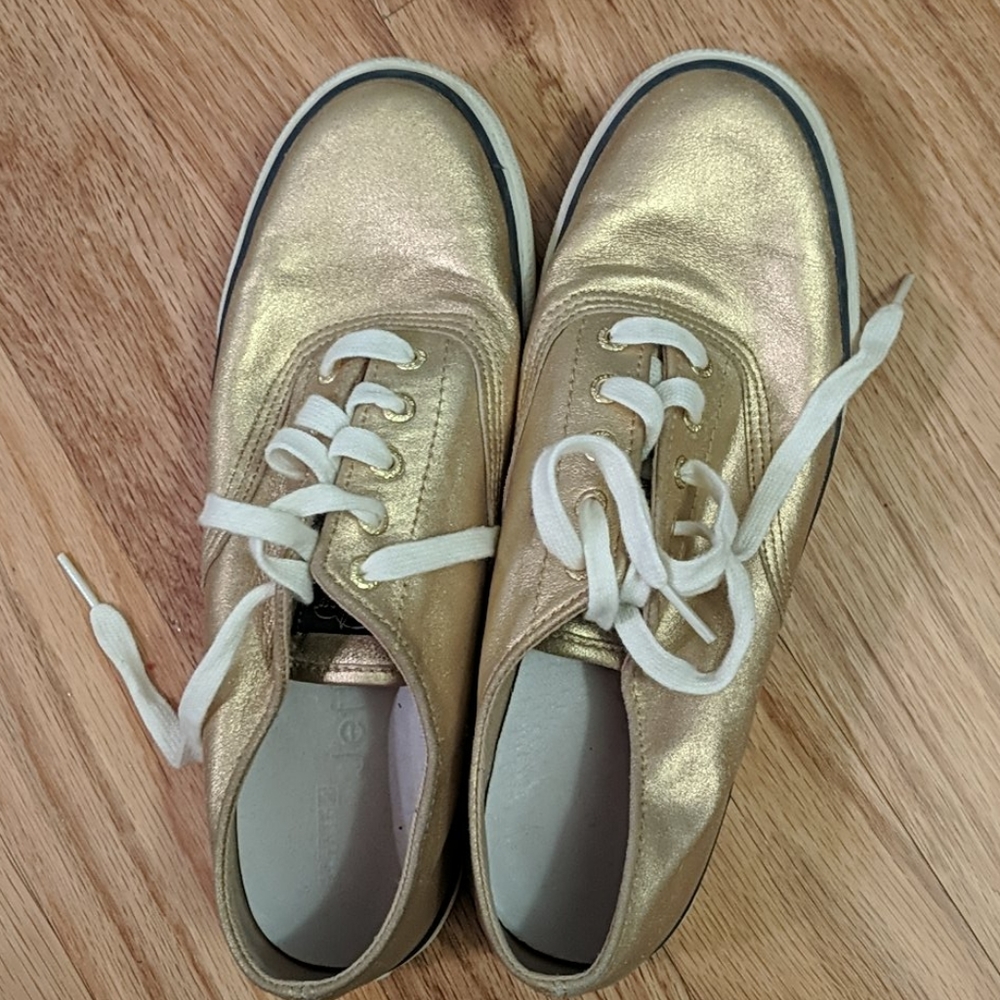 Gold Sperry sneakers